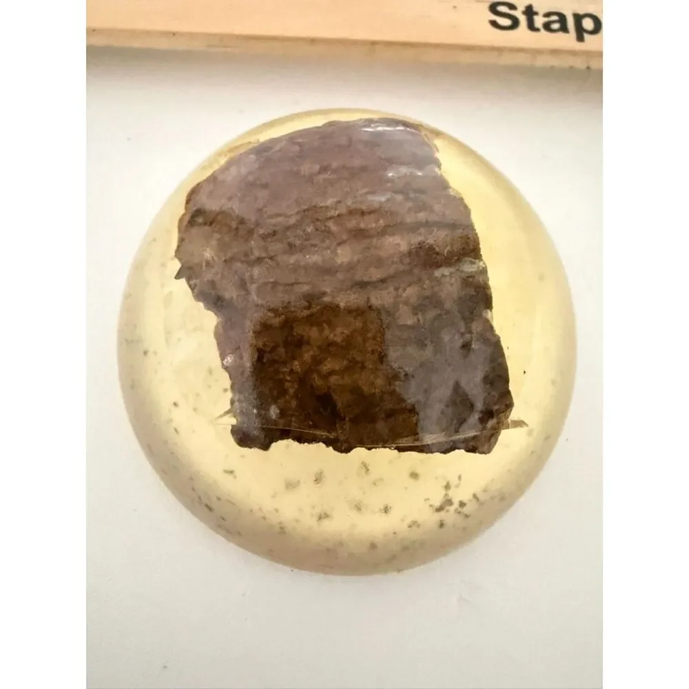 Vintage homemade paperweight with cloth or wood object